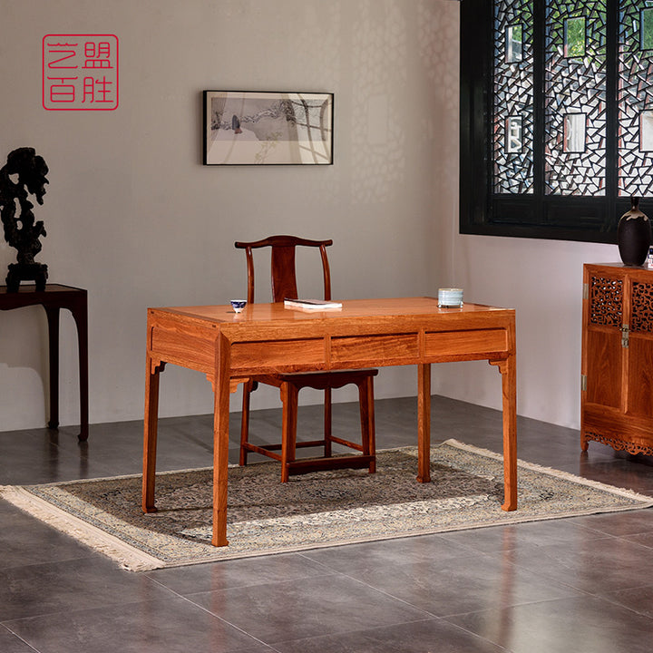 Elegant Pterocarpus macrocarpus desk with three drawers.