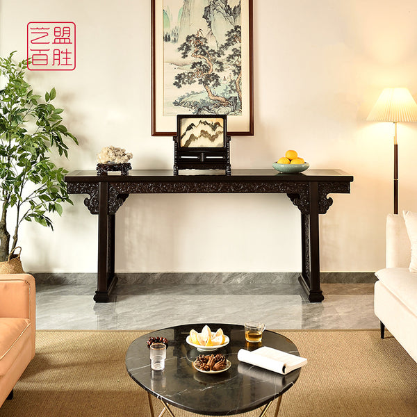 A long rectangular table made from African blackwood, featuring carved floral designs紫光檀西番莲条案