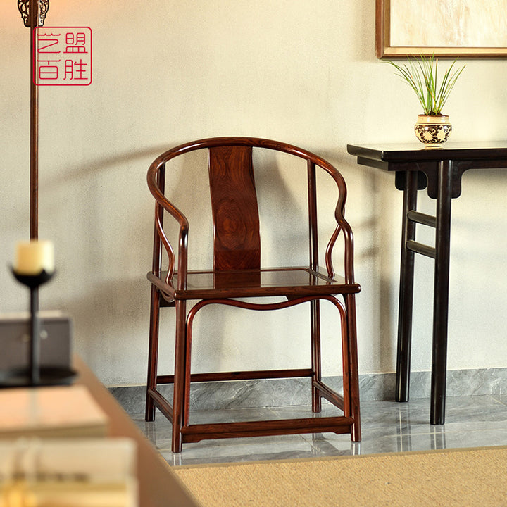 Elegant Granadillo wood armchair featuring a cane seat