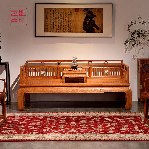 Elegant Pterocarpus Macrocarpus vertical slat daybed with intricate carvings.