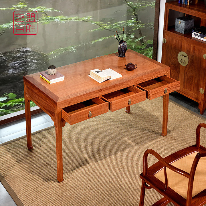 Pterocarpus macrocarpus wood desk featuring three drawers.