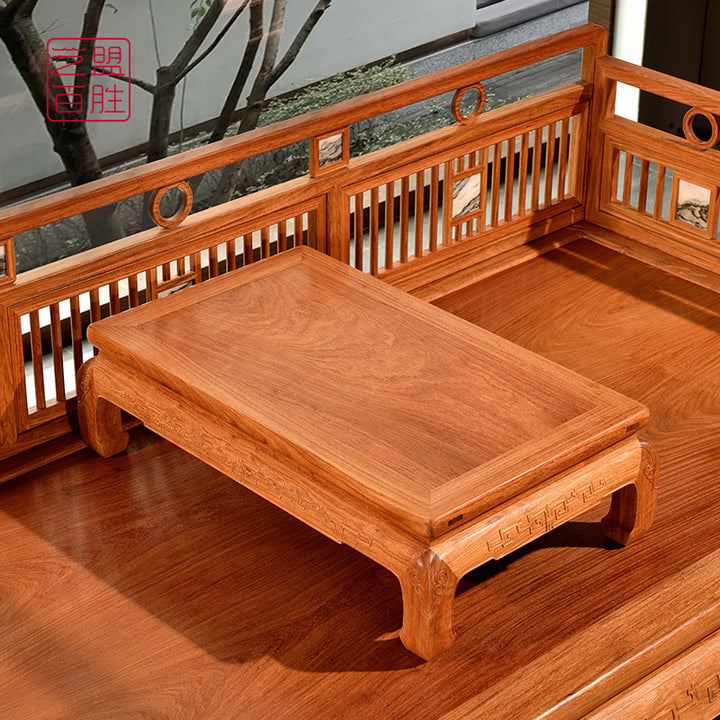 Classic Pterocarpus Macrocarpus daybed with traditional vertical slat design.