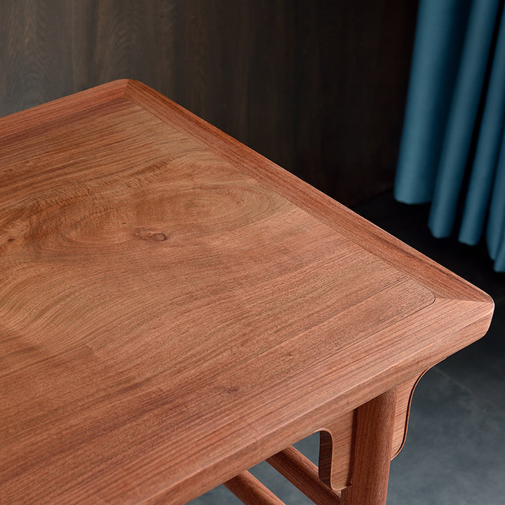 Beautifully crafted Pterocarpus macrocarpus desk with intricate details.