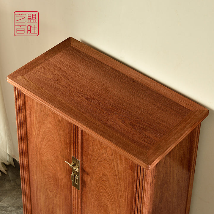 Tall Pterocarpus storage cabinet with traditional motifs