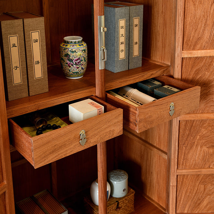 Classic wooden cabinet with a golden-brown finish and a central metallic handle.