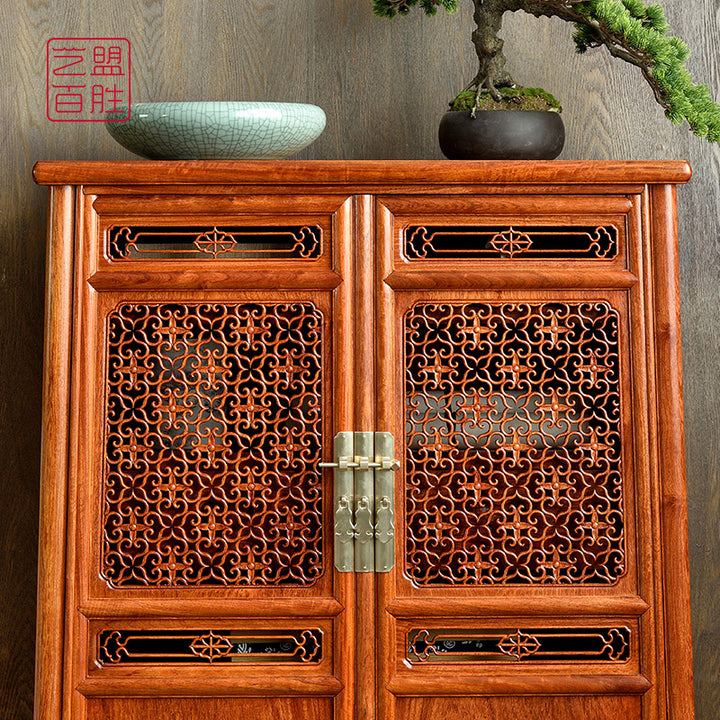 Luxurious Pterocarpus macrocarpus hollow carved corner cabinet showcasing detailed craftsmanship.