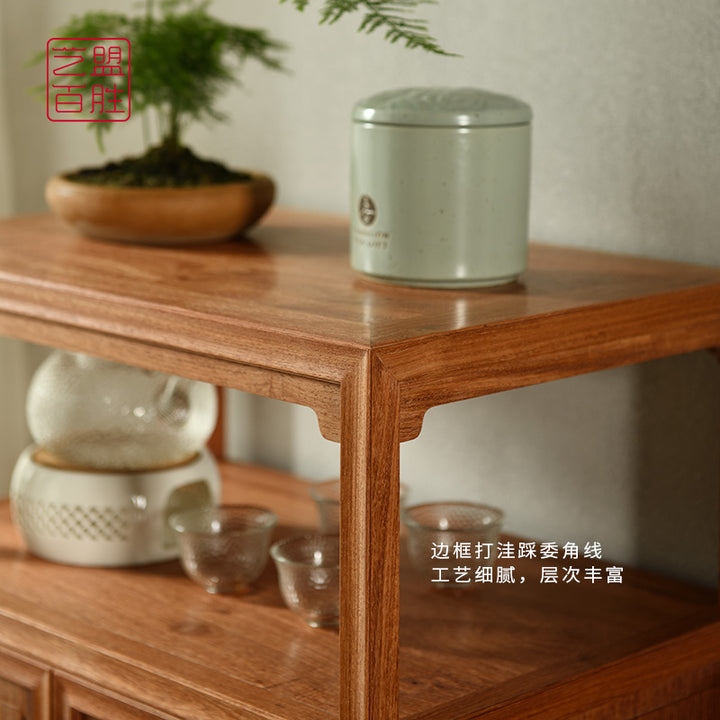 Elegant wooden tea and water cabinet with brass handles.