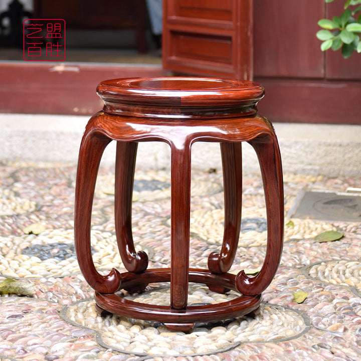 Handcrafted Granadillo wood round stool featuring five legs