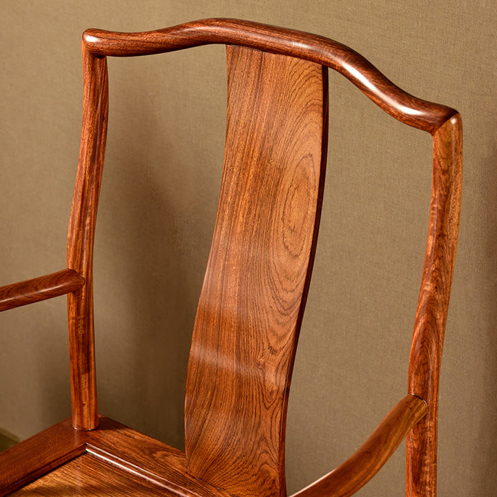 High-back Pterocarpus macrocarpus chair with curved armrests