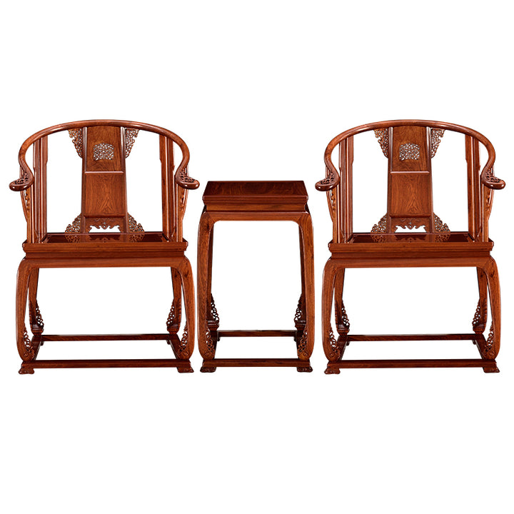 Handcrafted Pterocarpus chair set featuring scroll carvings and a small table