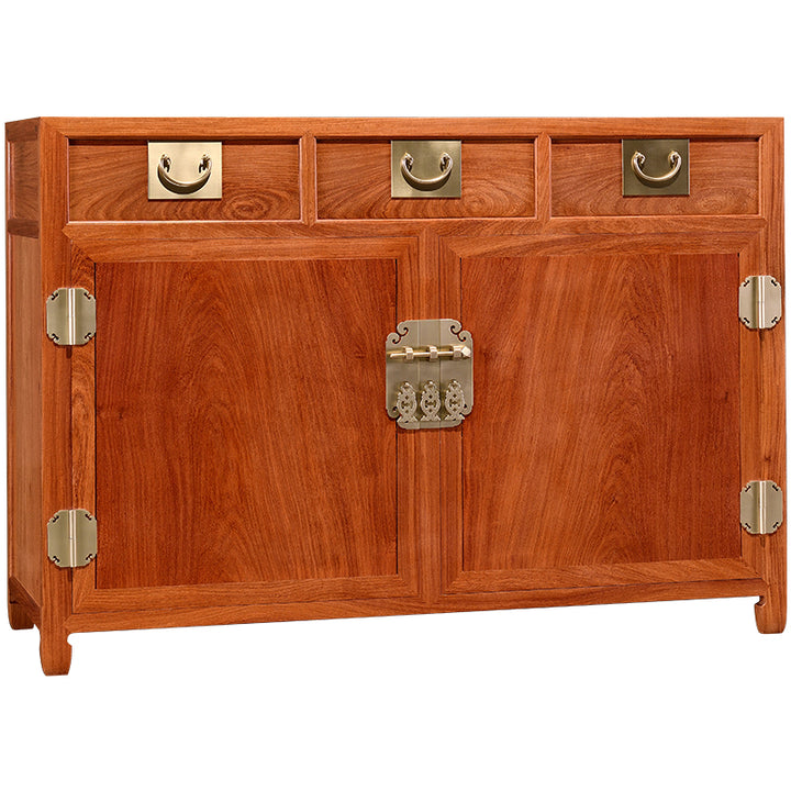 Stylish four-drawer sideboard in Pterocarpus macrocarpus with brass accents.