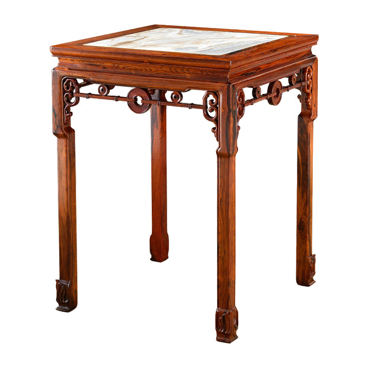 Handcrafted rosewood table with a micro-concave design and a marble top, perfect for elegant interiors