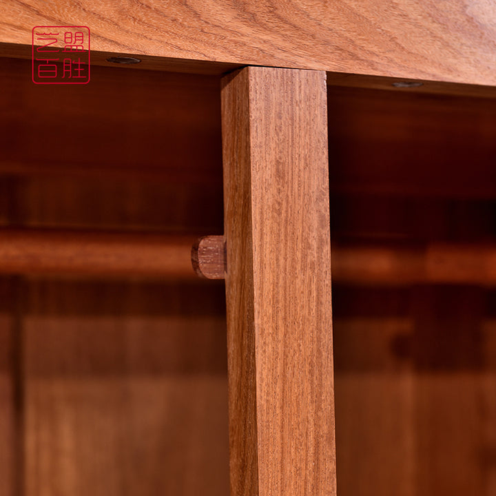 Traditional Chinese cabinet with a distinctive rolling cloud top and metal accents.