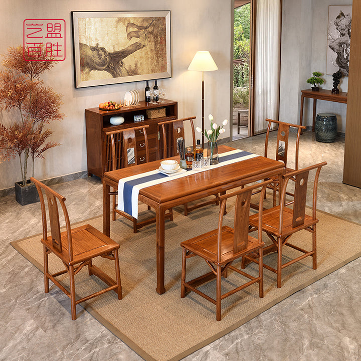 Pterocarpus Macrocarpus dining table with six chairs in a modern dining room.