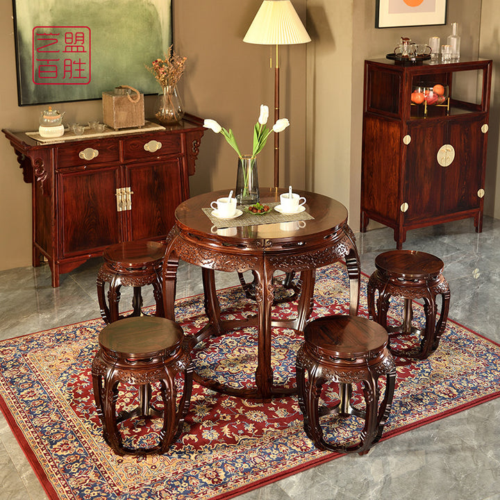 Luxurious rosewood circular table featuring detailed craftsmanship on legs and tabletop