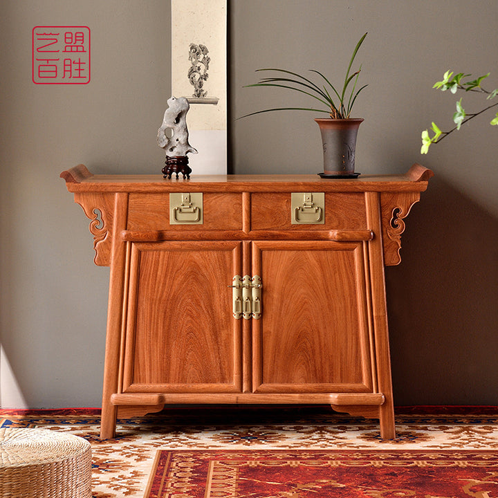 Pterocarpus macrocarpus sideboard with two drawers and intricate carvings.