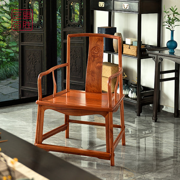 A Pterocarpus macrocarpus chair with a fan-shaped wooden seat.