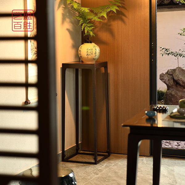 flower stand with vertical corners inlaid with Burmese rosewood in African blackwood. 紫光檀四面平如意腿香几