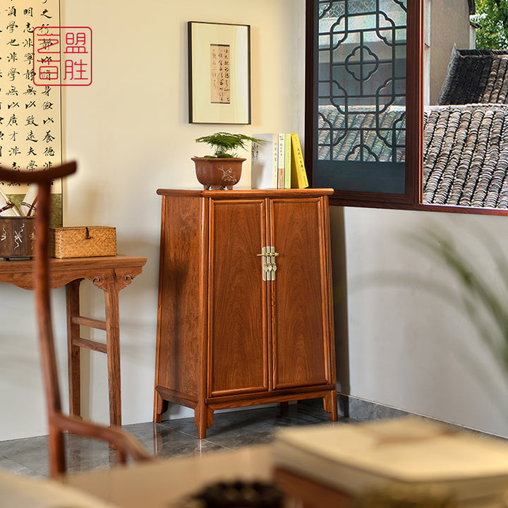 Beautifully crafted rosewood cabinet featuring a classic design.