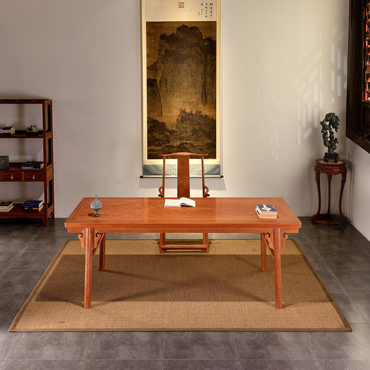 Detailed view of a Pterocarpus macrocarpus desk with intricate carving