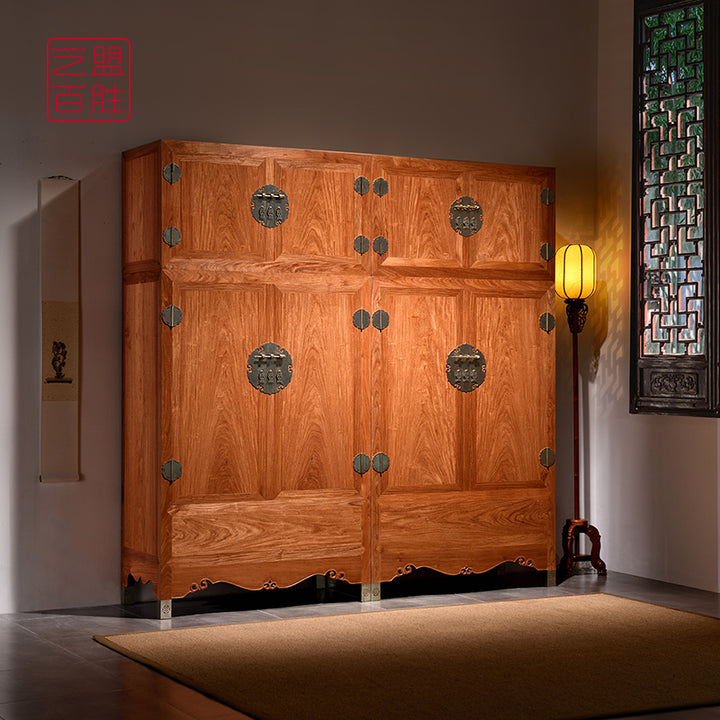 Elegant wooden cabinet featuring traditional Chinese style hardware and intricate top detailing.