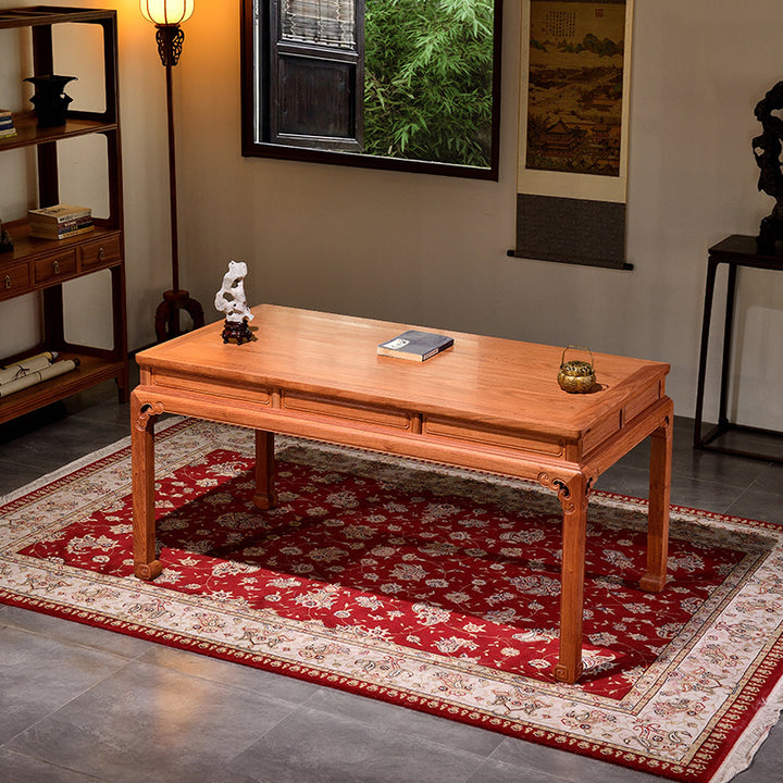 Handcrafted wooden desk with intricate cloud designs