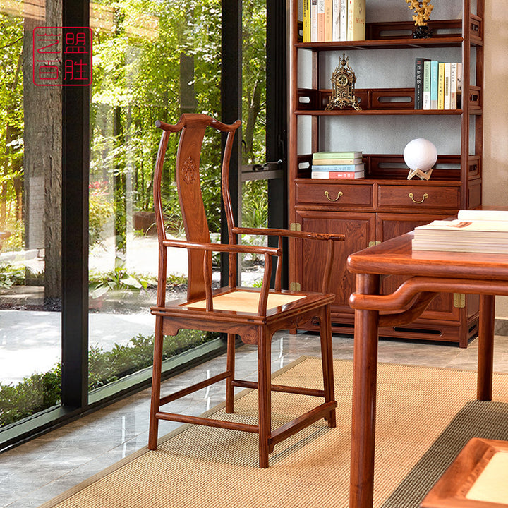 Elegant Chinese hardwood chair with intricate carvings.