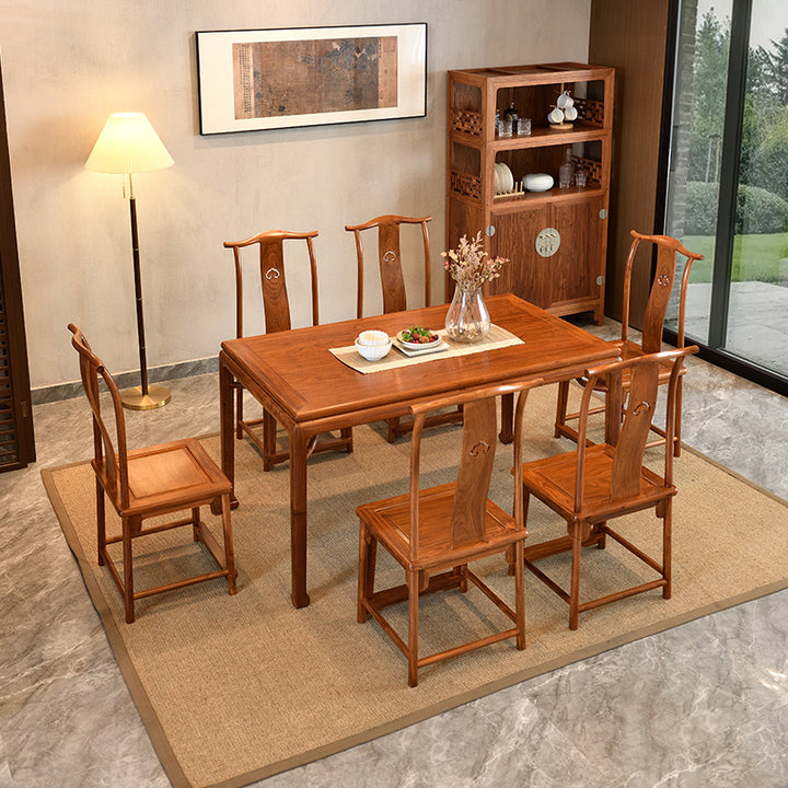 Elegant wooden dining table and chairs in a contemporary dining space.