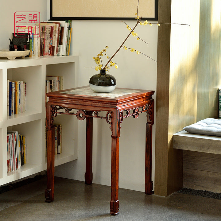 Small square rosewood table featuring a detailed marble inlay in a cloud pattern