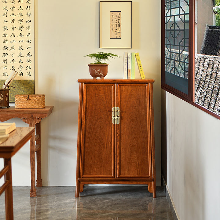 Two-door rosewood cabinet with traditional Chinese brass hardware.