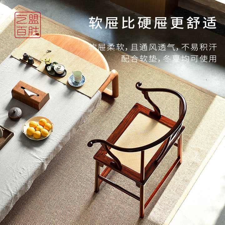 Traditional Chinese round-back armchair with cane seat