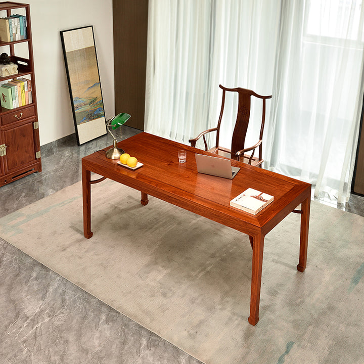 Handcrafted rosewood table with a sleek and minimalist design.