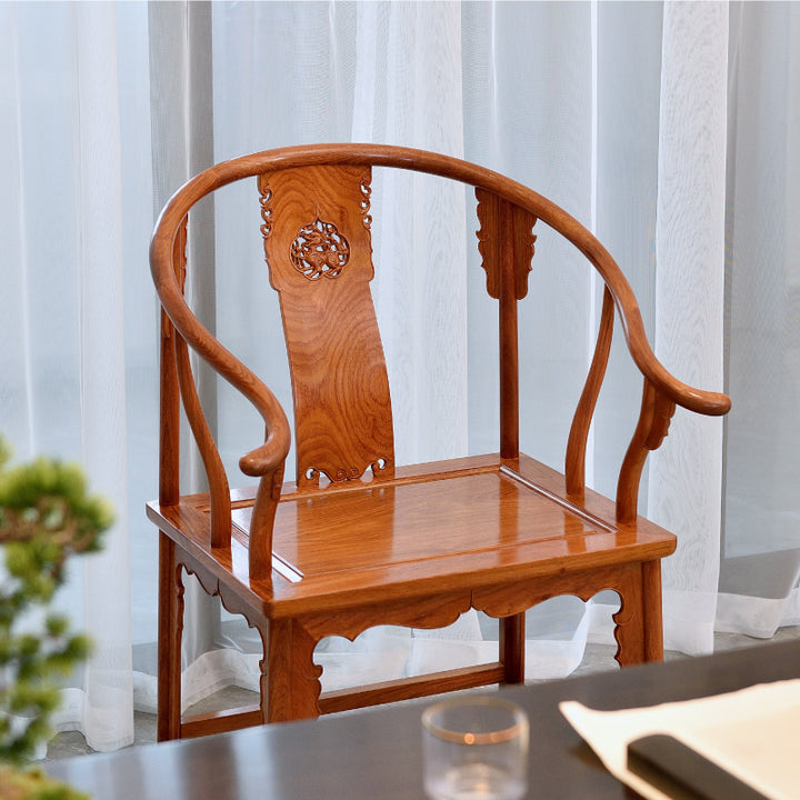 Handcrafted Burmese Padauk half-round armchair with intricate Qilin carvings.