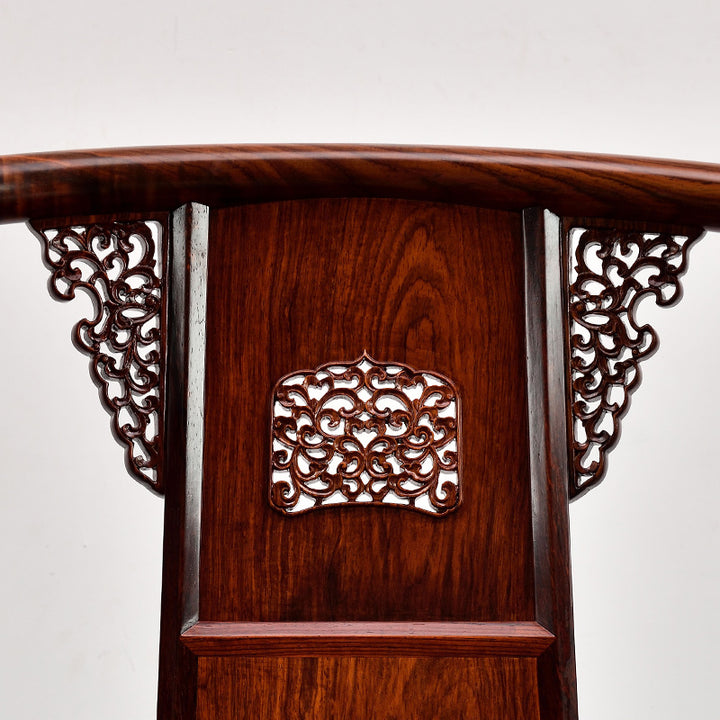 Front-facing image of a Huanghuali circle chair with detailed backrest design