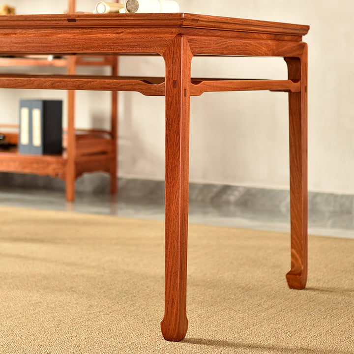 Classic Pterocarpus macrocarpus table featuring intricate joinery.