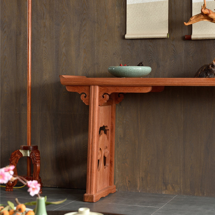 Luxurious Pterocarpus macrocarpus console table with decorative side carvings