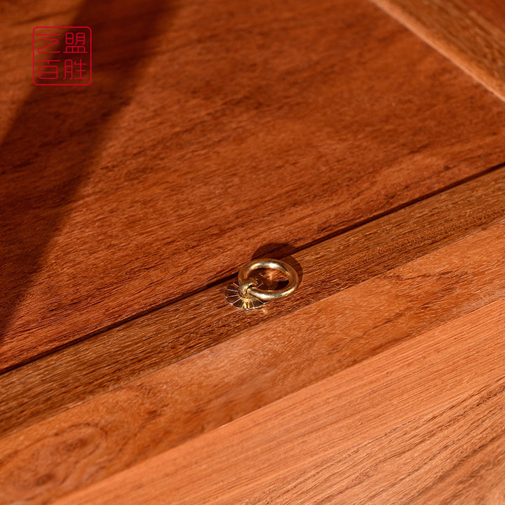 Classic Chinese-style wooden cabinet with round metal handles and a decorative top.