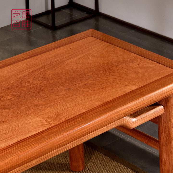 Exquisite wooden desk with intricate craftsmanship and tea set