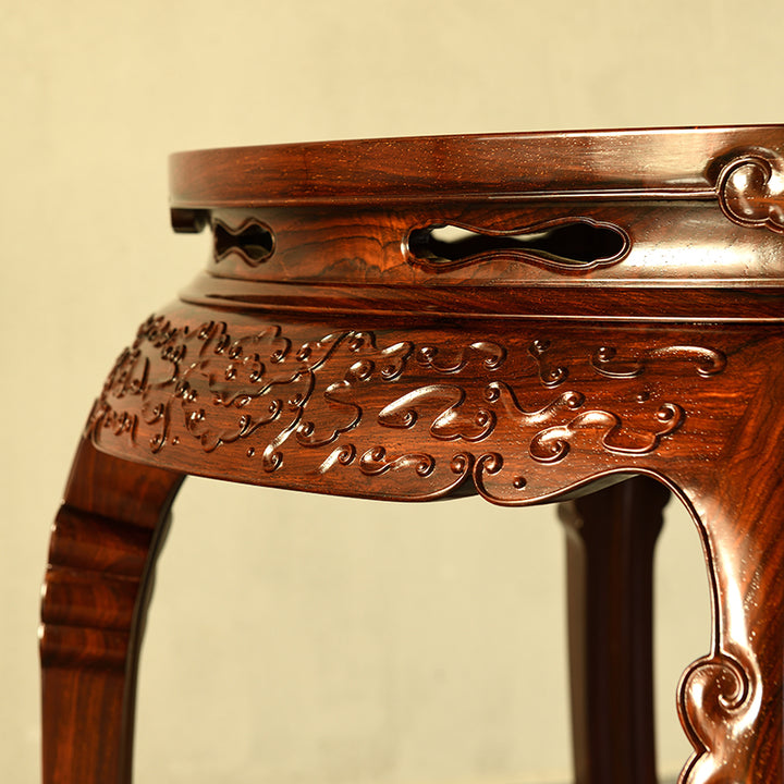 Vintage concave rosewood table with floral patterns carved into its five legs