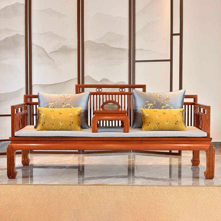 Exquisite Pterocarpus macrocarpus sofa set with matching end tables and a spacious coffee table.