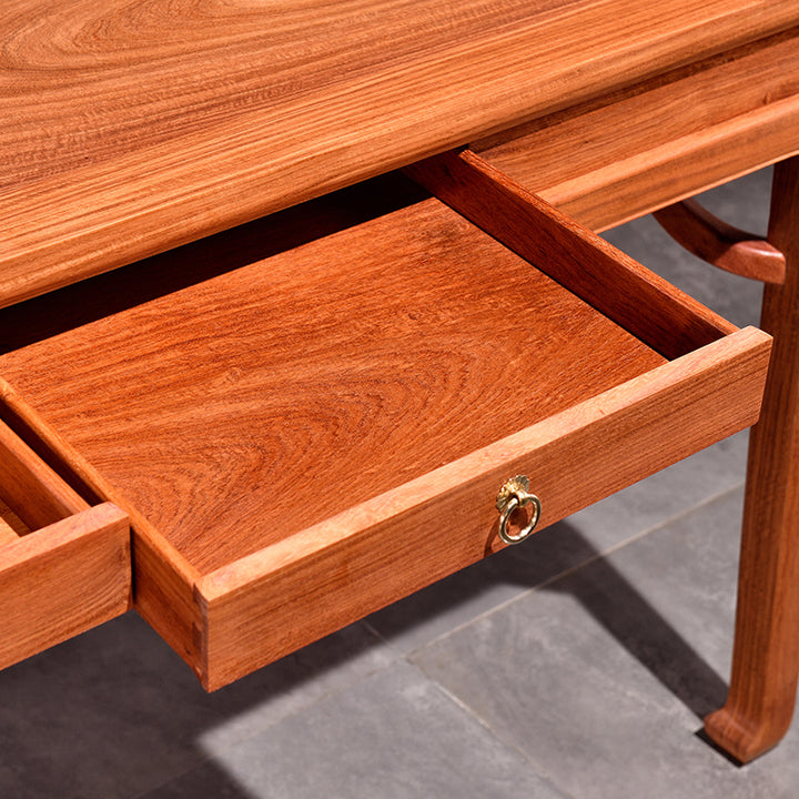 Classic Pterocarpus Macrocarpus desk featuring six spacious drawers.