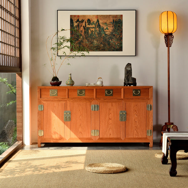 A dining sideboard with four drawers and brass hardware, made of Pterocarpus macrocarpus.