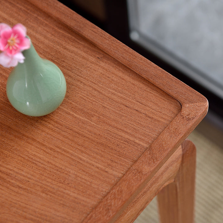 Classic Pterocarpus macrocarpus small table with elegant decor.