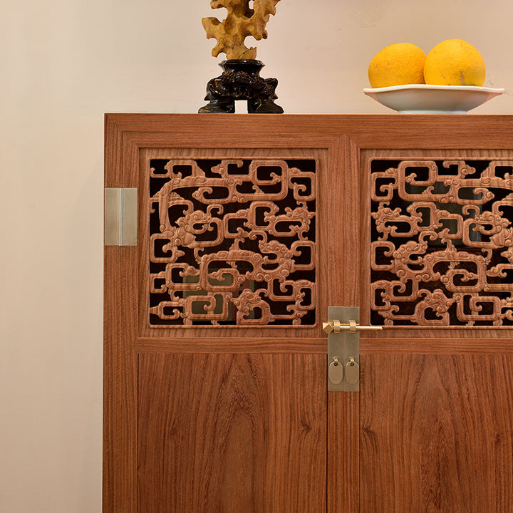 Decorative Pterocarpus cabinet with traditional Chinese dragon carvings.