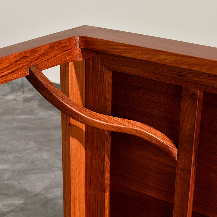 Handcrafted rosewood table with a sleek and minimalist design.