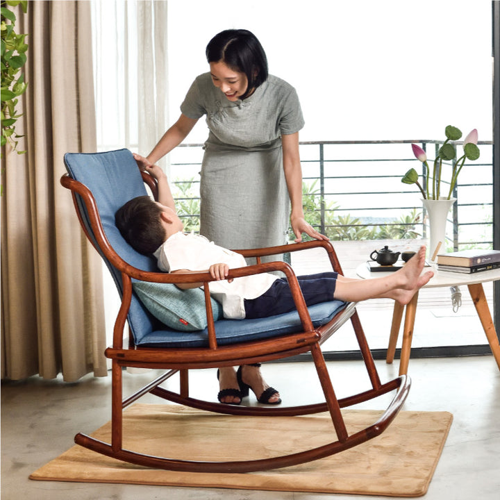 Traditional Chinese rosewood rocking chair with sleek, curved lines