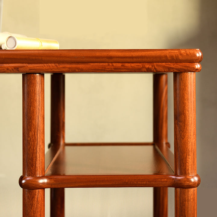 Elegant Pterocarpus macrocarpus desk featuring open shelving design.