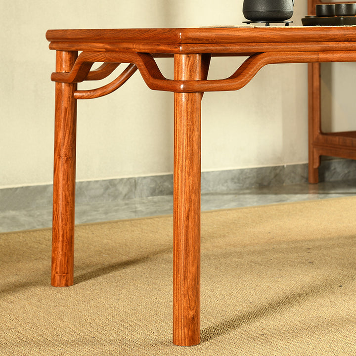 Traditional Pterocarpus Macrocarpus tea table with round legs and five chairs.