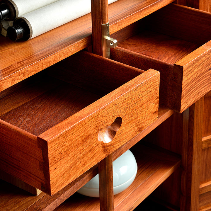 Elegant Pterocarpus macrocarpus corner cabinet featuring detailed hollow carvings.