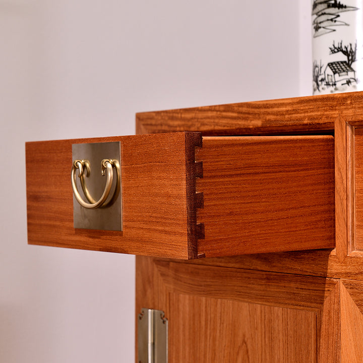 Elegant Pterocarpus macrocarpus sideboard with four drawers and cabinet doors.